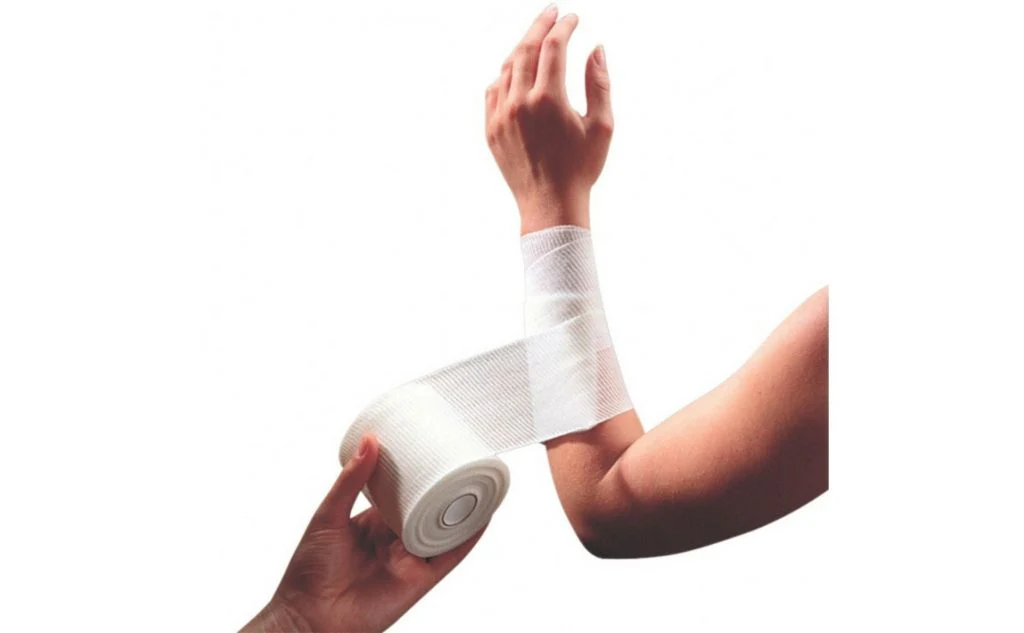 a lower arm being wrapped in a bandage